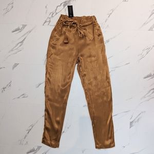 Gold high waisted belted trousers